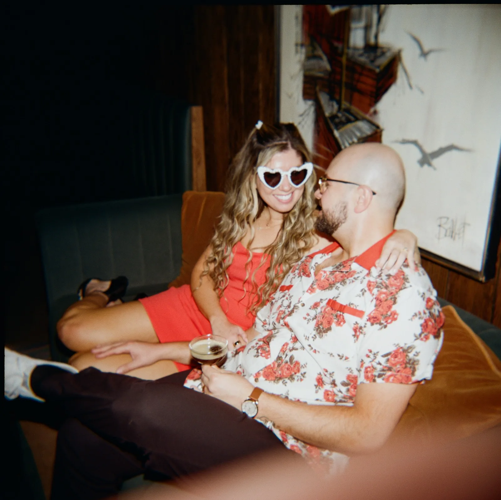 Nicole and Ian in a booth at the bar